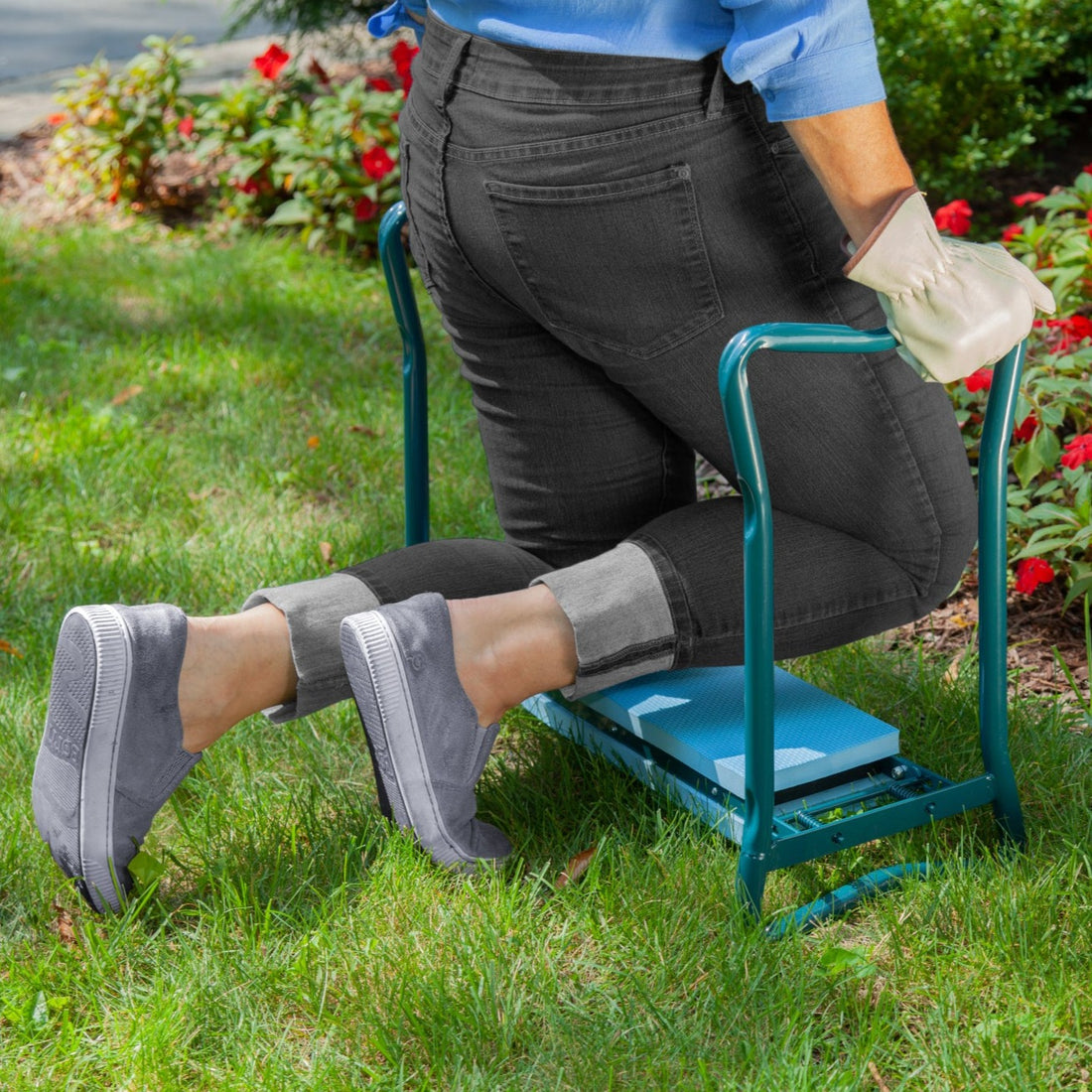 Garden Kneeler in use with woman using as kneeler pushing up to stand